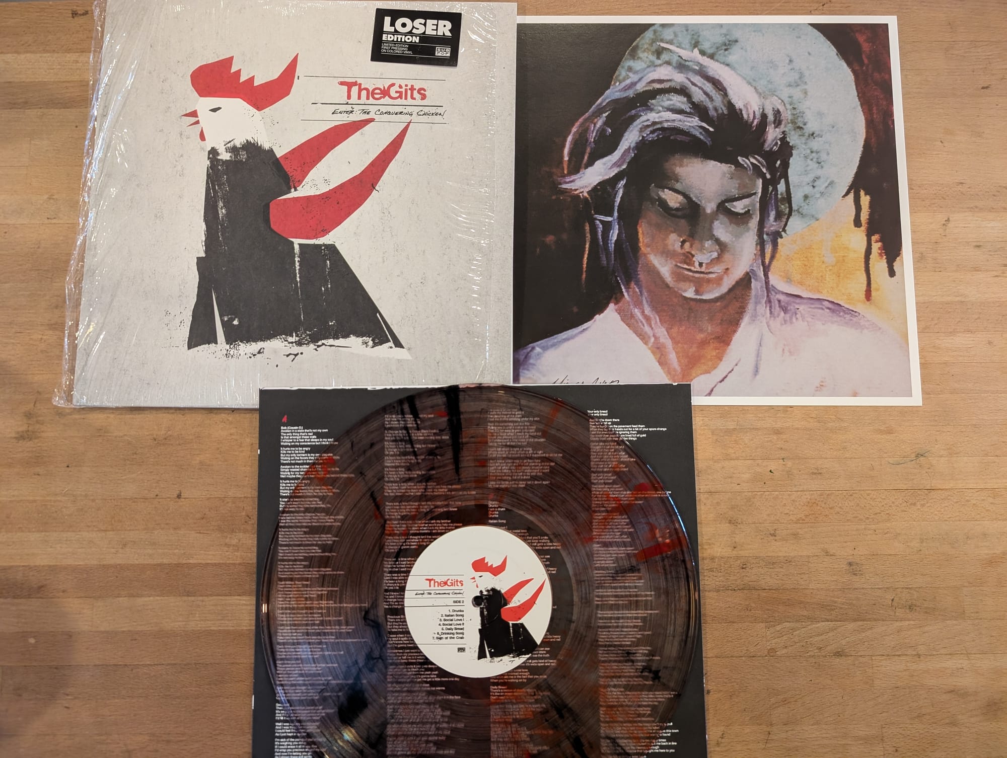 Contents of the vinyl reissue of the Gits' Enter: The Conquering Chicken.